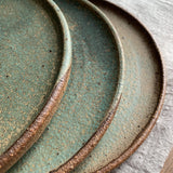 Stacked green flat plates by Sticky Earth Ceramics SG