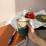 Green-White Handmade Ceramic Cup with Tea  - Sticky Earth Ceramics Singapore
